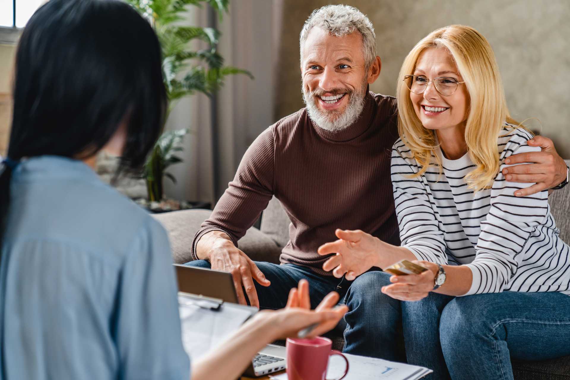 a couple happily engaing with a tax professional